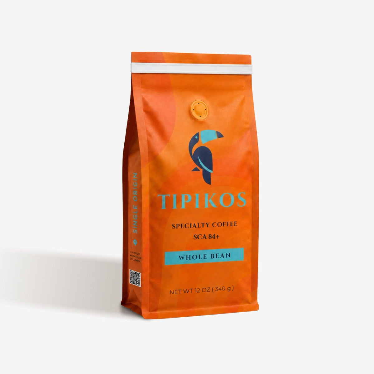 Front view of TIPIKOS Colombian Medium Roast Whole Bean Coffee bag, 12 oz, 100% Arabica